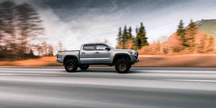2024 Toyota Tacoma Hybrid driving down the highway.