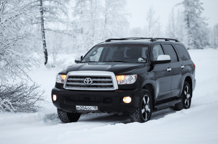 A black Toyota Sequoia parked in the snow.