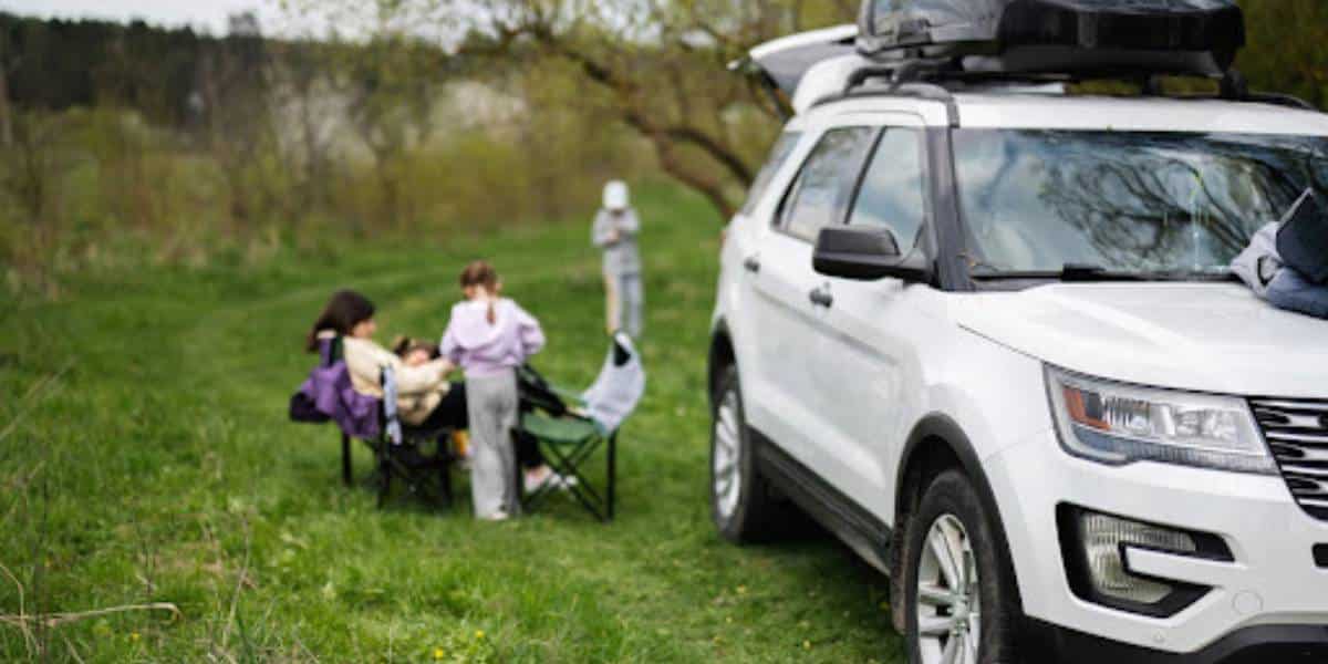 A family hanging outside of one of the best 3 row suvs.